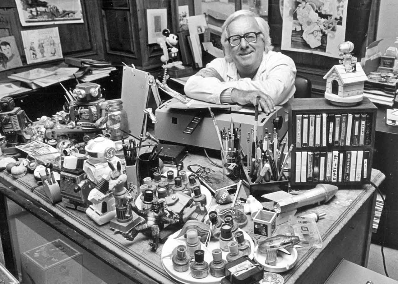 Black and white photo of author and renowned science fiction writer, Ray Bradbury at his desk
