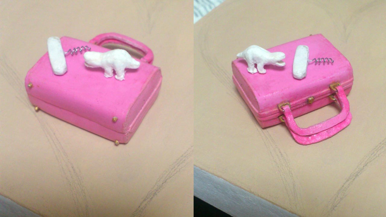 Two extreme close up images of the miniature pink purse on its side with two work in progress stone clay pieces of a swiss army knife corkscrew and toy lizard