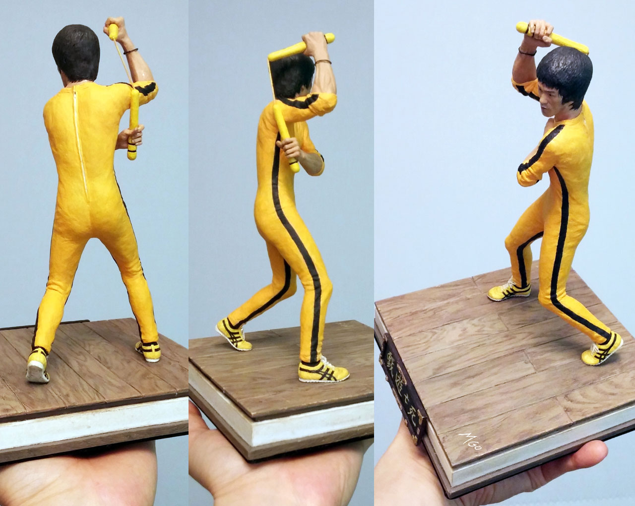 Three full body images of the completed miniature statue Hai Tien of Game of Death with nunchaku and base