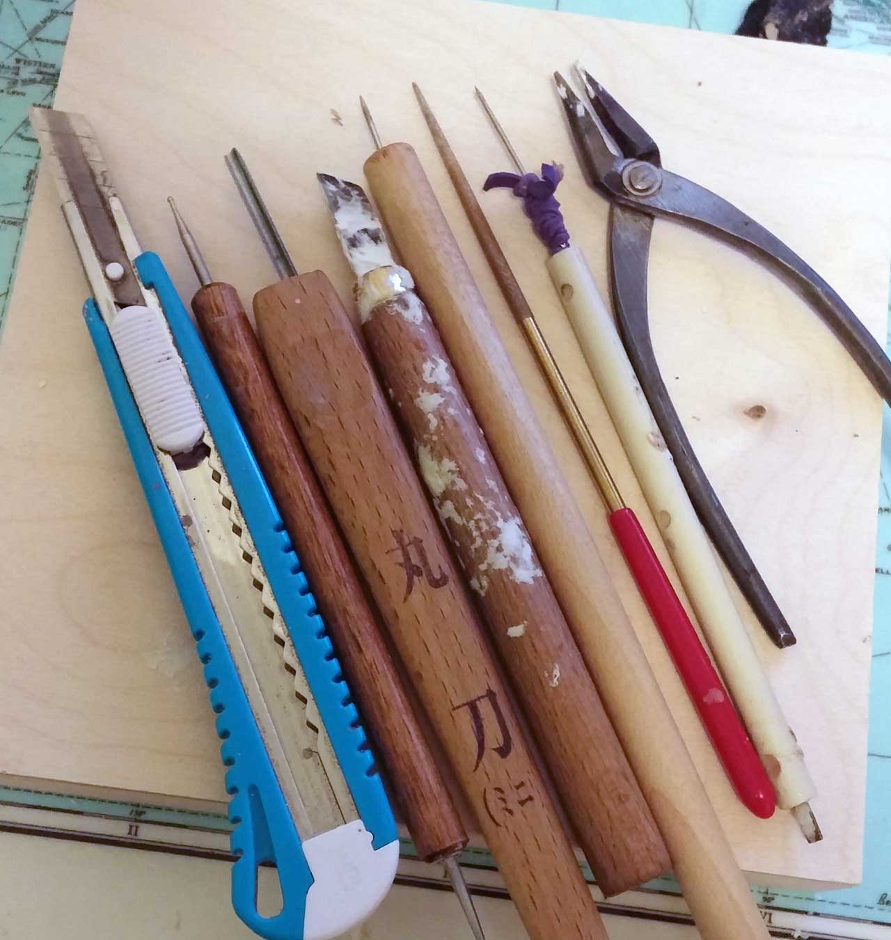 sculpting and crafting tools on desk
