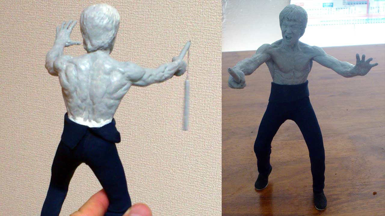 Two images side by side of the back and front view of the miniature statue in gray primer paint