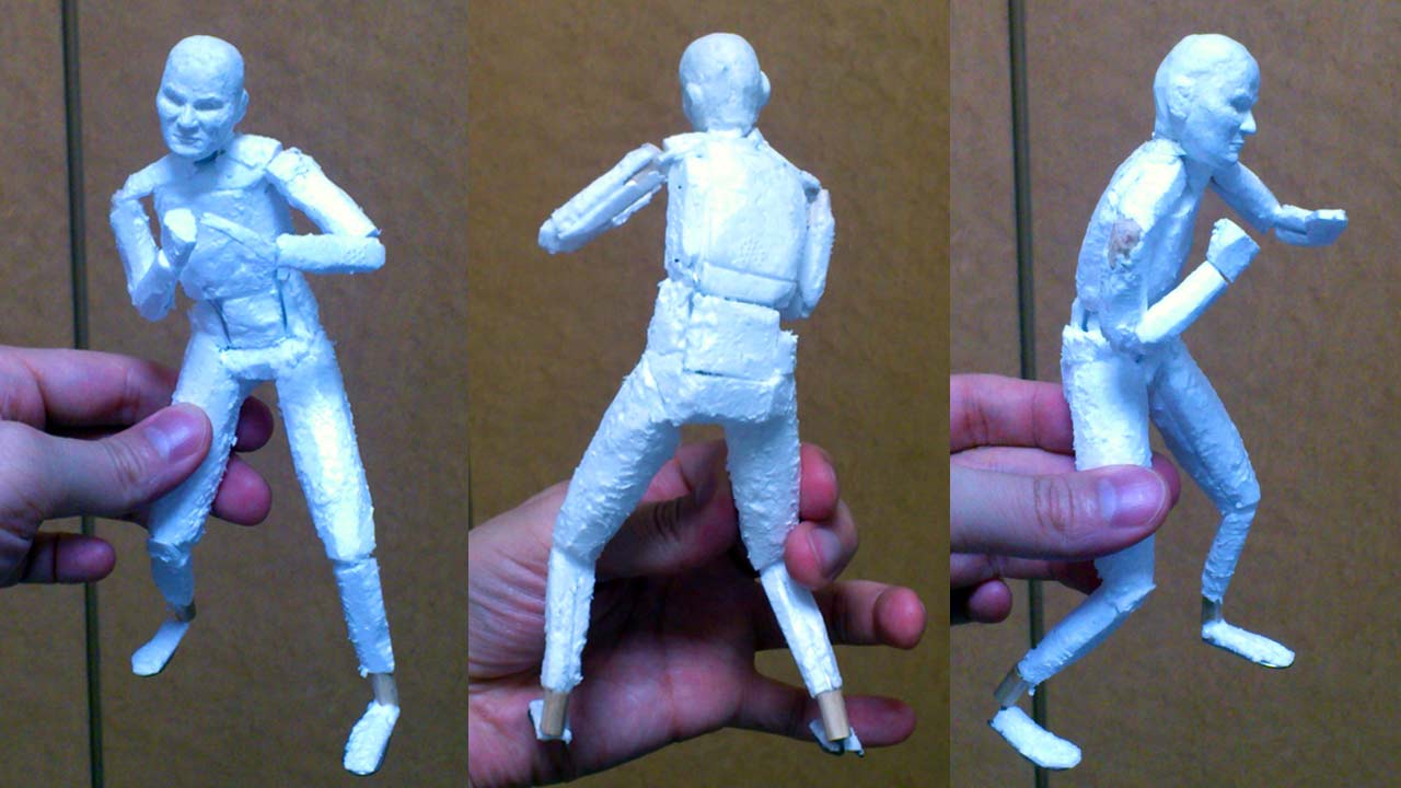 Three medium close up images side by side by side of the miniature statue full body in a styrofoam constructed torso and limbs with stone clay head without hair