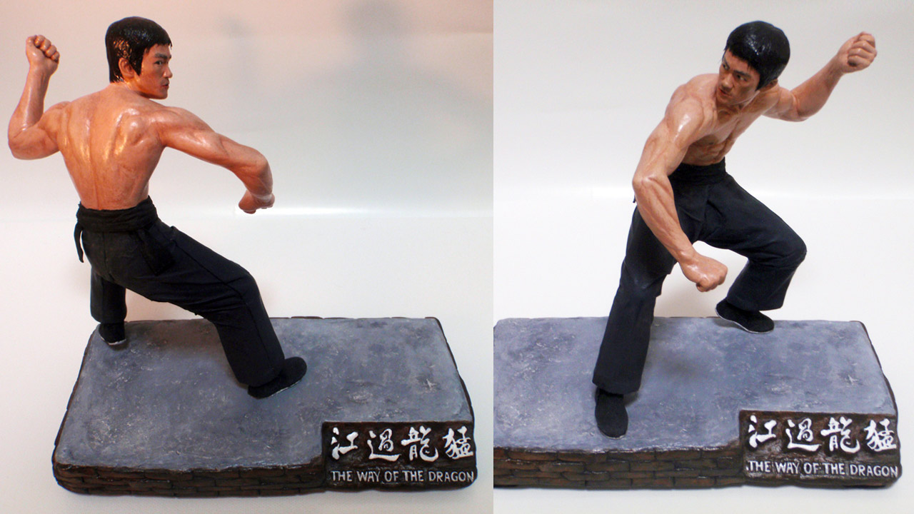 Two images in full body shots of the completed miniature statue of Tang Lung with various angles and lighting on base